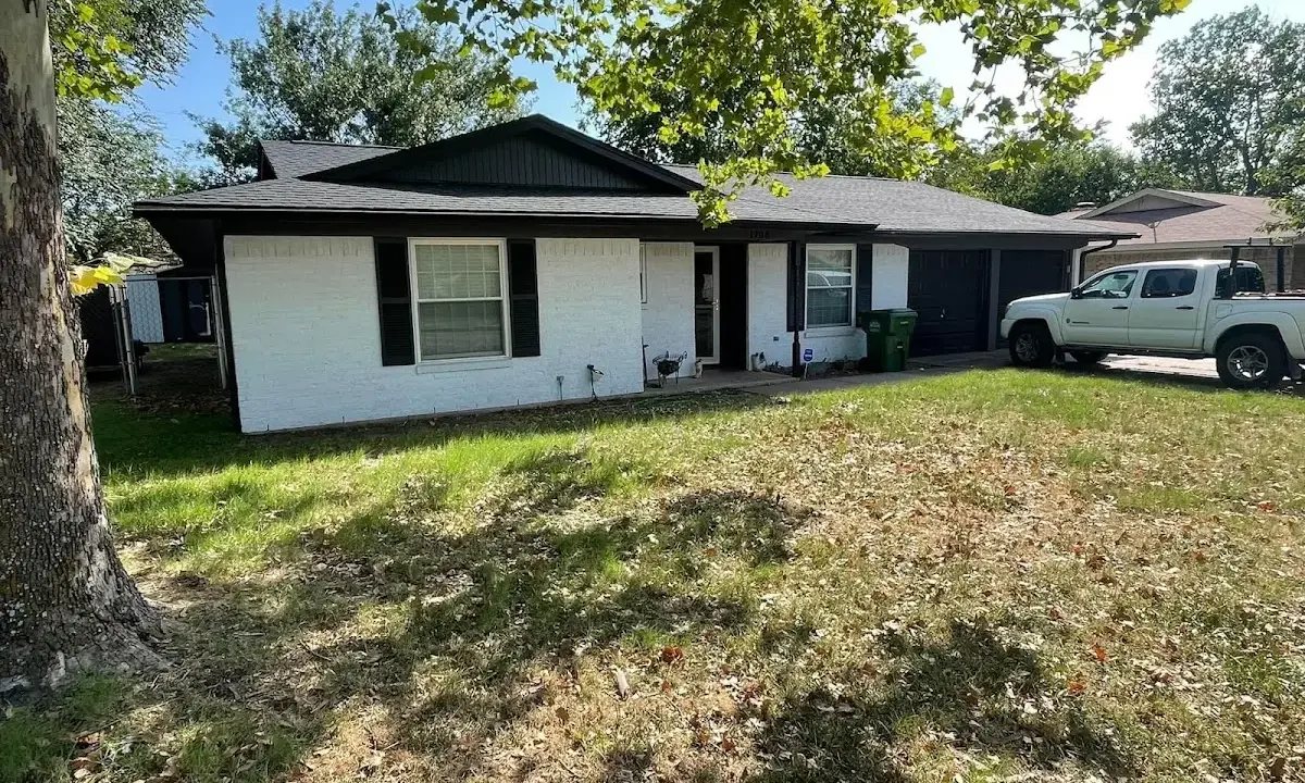 Professional roofing crew working on a residential roof in Viera East